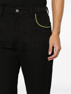 MOSCHINO COUTURE PANTALONE CON LOGO ALL OVER NERO